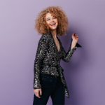 cheerful-blond-woman-disco-style-clothes-laughs-poses-lilac-background